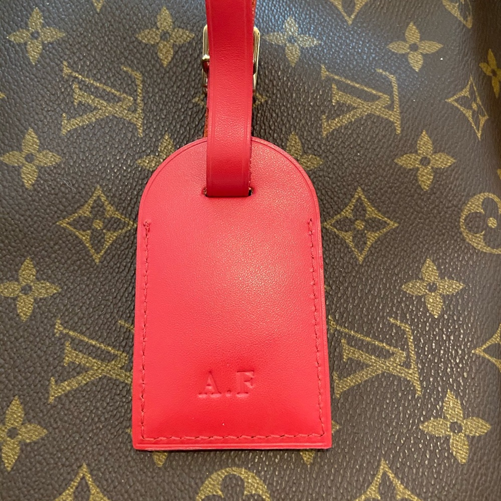 AUTHENTIC Louis Vuitton red luggage tag